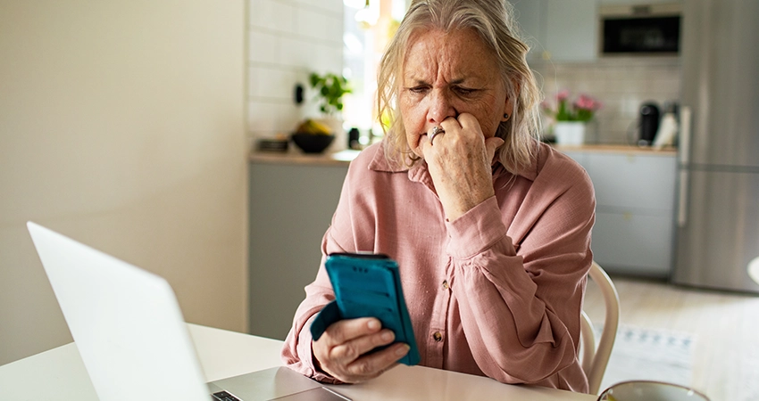 concerned woman holding phone
