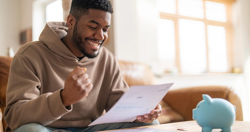 male student holding paper